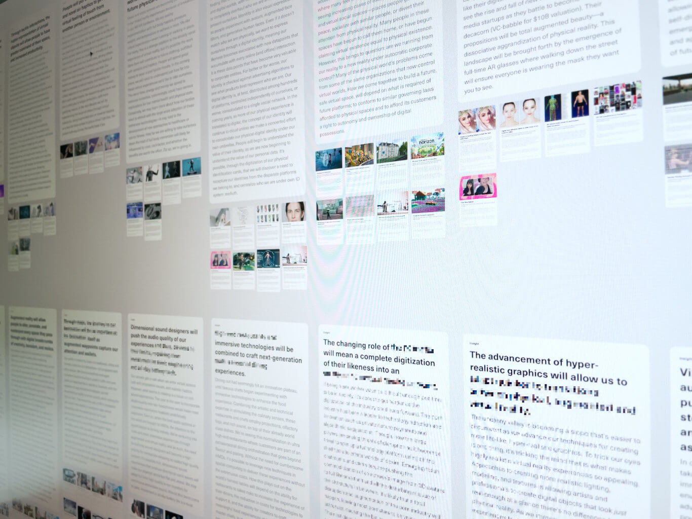 A photo of insights and theme cards on a computer screen
